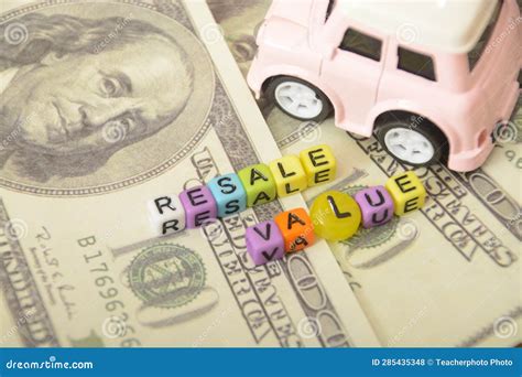 Photos Featuring Toy Cars with Miniature Dollar Bills, Symbolizing the Potential Profits in the ...