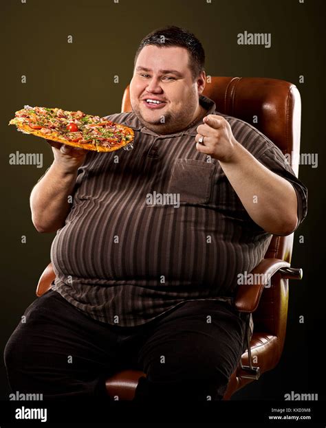 Fat man eating fast food pizza. Breakfast for overweight person Stock ...