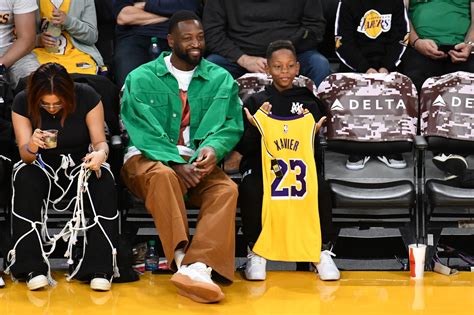 Dwyane Wade Steps Out With His Youngest Son Xavier For A Lakers Game | Essence