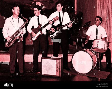 A vintage late 1950s or early 1960s photograph of a college rock and ...