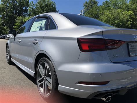 Rear-angled view of the 2018 Audi A3 in florett silver metallic. Vehicle available at Audi of ...