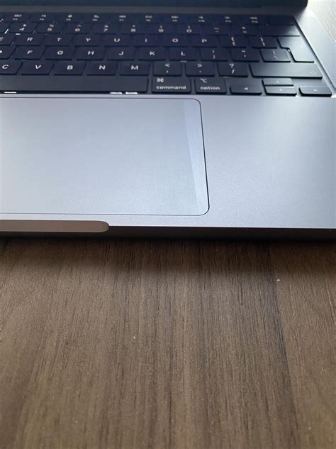 New MacBook Pro 14 has a stripe/discoloration on trackpad. Should I ask ...