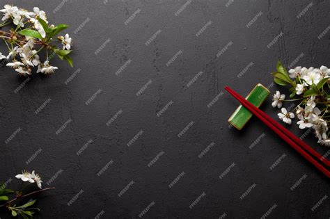 Premium Photo | Japanese food with cherry blossom and sushi chopsticks