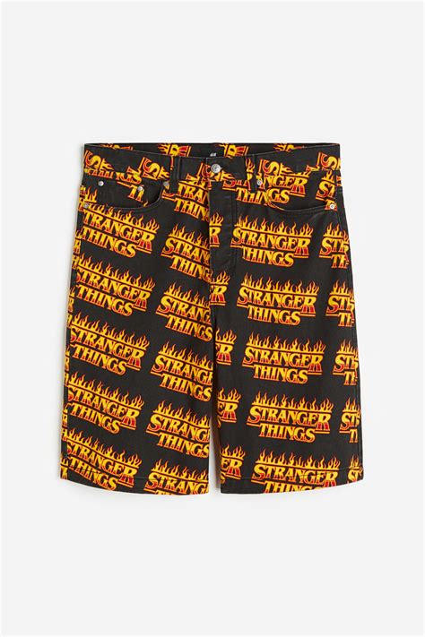 Loose Fit Printed twill shorts - Black/Stranger Things - Men | H&M IN