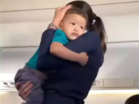 Flight Attendant Calms Down Crying Baby On Airplane