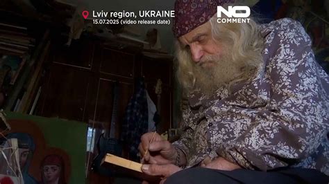 Ukrainian artist paints icons on ammunition boxes to boost soldiers' morale