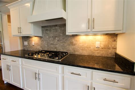 Gray Stone Subway Tile Backsplash White Cabinets and Dark Granite ...