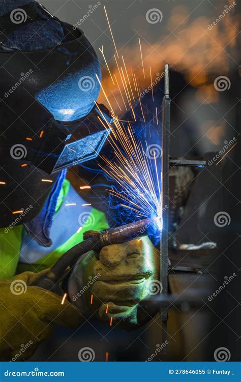 The Welder is Welding a Structural Steel with Gas Metal Arc Welding ...