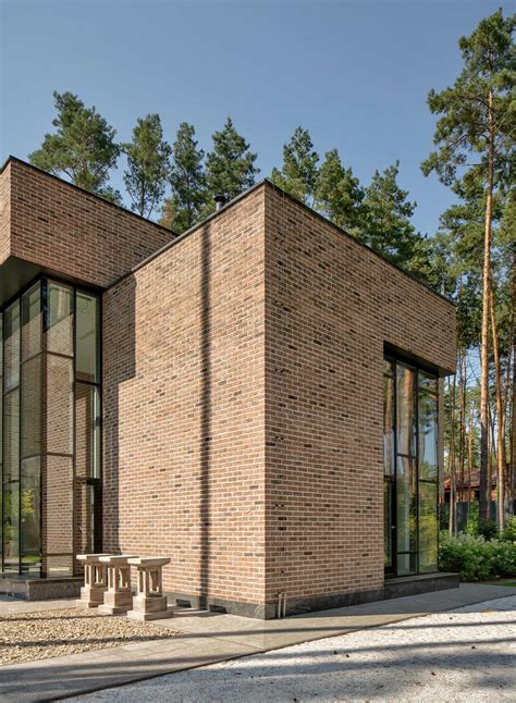 The Modern Brick Exterior Of This House Stands Out From The Forest And ...