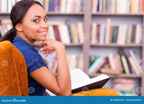 Reading a book in library. stock photo. Image of intelligence - 42306376