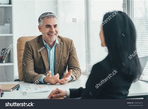 Two Business People Talking 的图像结果