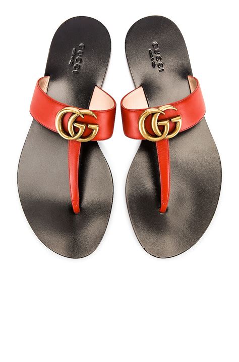Gucci Double G Leather Thong Sandals in Bright Pumpkin | FWRD