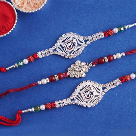 Send Exclusive set of 3 silver-plated Rakhi - Russia Online ...