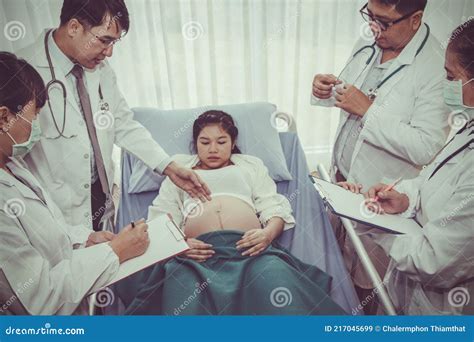 Team of Obstetricians and Doctors Jointly Check the Health of a Woman Who is Pregnant Near Birth ...