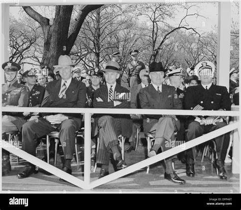 President Harry S. Truman sits at the reviewing stand during Army Day ...