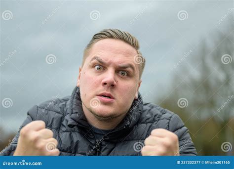 Furious Young Man Clenching His Fists in a Rage Stock Image - Image of ...