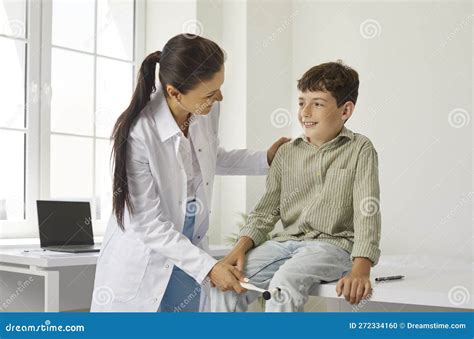 Doctor Neuropathologist with Special Hammer Checks Knee Reflexes on Leg Preteen Boy. Stock Photo ...