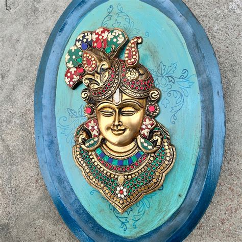 Green Wooden Art With Brass Krishna Face With Stonework – The Advitya