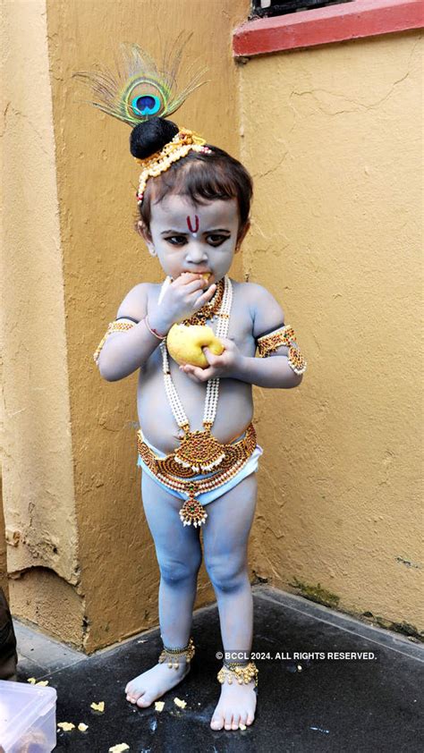 Toddler dressed up as Lord Krishna during the Janmashtami festival ...