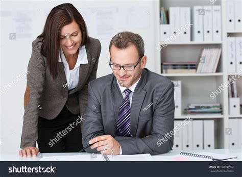 Businessman Working at Desk 的图像结果