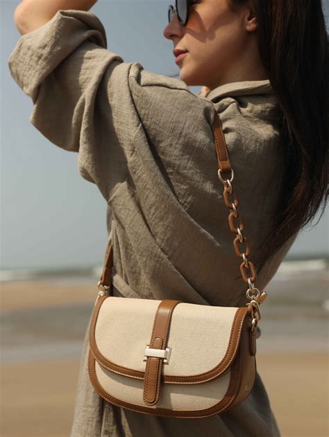 Buy Now Women Tan Self Design Structured Sling Bag