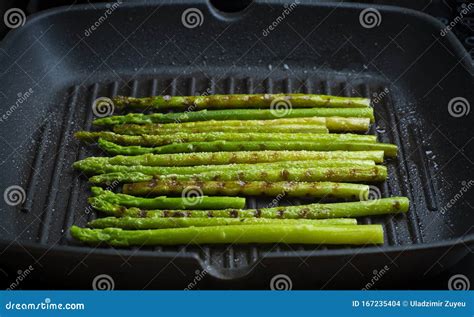 Grilled Asparagus. Fried Asparagus in a Pan. Grilled Vegetables on the ...