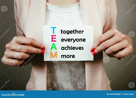 Business Woman Holding Paper Sheet with Team Acronym - Together Everyone Achieves More Stock ...