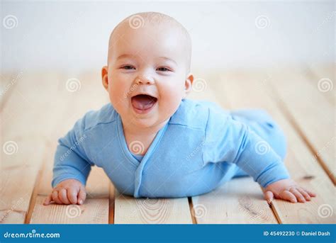 Cute Happy Baby Boy Crawling on the Floor Stock Photo - Image of wooden ...