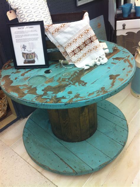 Table made from old cable spool. Wheels added to base so it will roll ...