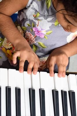 Kids Playing Piano Stock Photos, Images and Backgrounds for Free Download