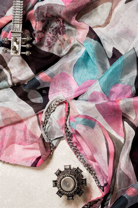 Abstract Multi-Print Saree with Shifting Crystal Embroidery – WeaveinIndia