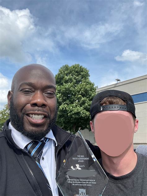 Juvenile Parole Officer Ali is pictured with parole youth receiving top honors as the selected ...