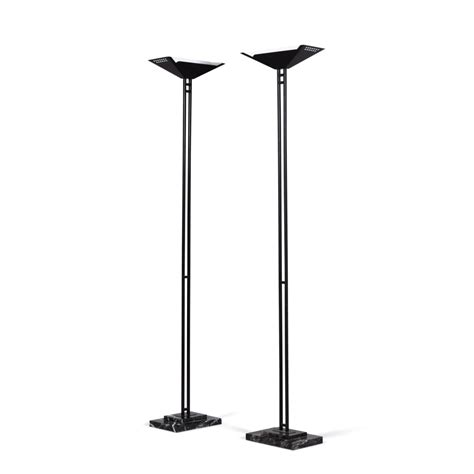 A pair of black painted metal uplighter floor lamps, Glasgow School ...