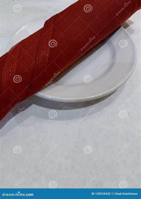 White Table Cloth, White Plate, and Red Cloth Napkin Stock Photo ...