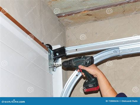 Contractor Installing Garage Door. Stock Photo - Image of skill ...