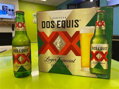 Download Dos Equis Beer Bottleand Packaging Wallpaper | Wallpapers.com