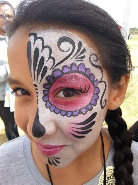 Simple and pretty half day of the dead/sugar skull face painting makeup ...