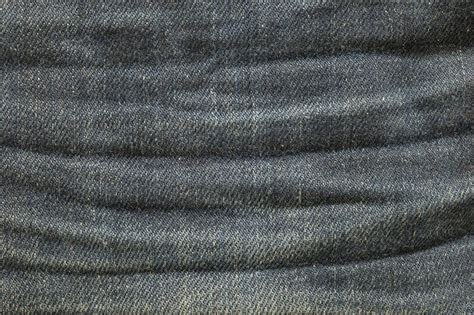Closeup old jean trousers fabric texture background | Premium Photo