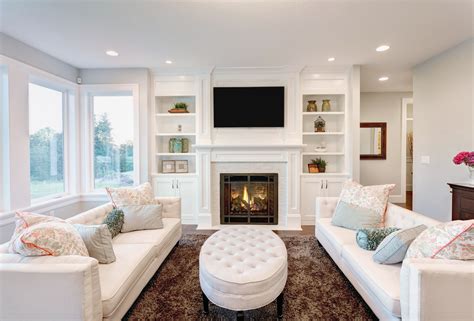 White Family Room with Built-In Shelving and Sofas