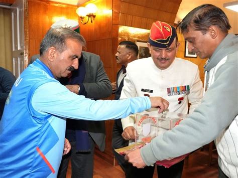 Brigadier Madan Sheel Sharma pins armed forces flag to Himachal CM on ...