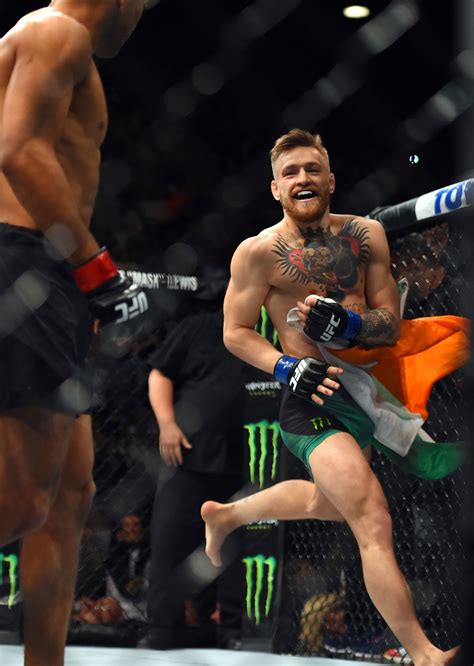 Conor McGregor knocks out Jose Aldo at UFC 194 - Photos: Conor McGregor ...