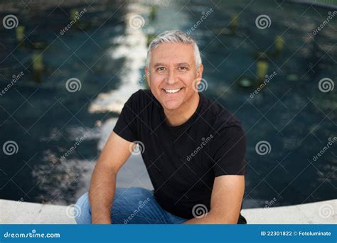 Handsome middle age man stock photo. Image of kneeling - 22301822