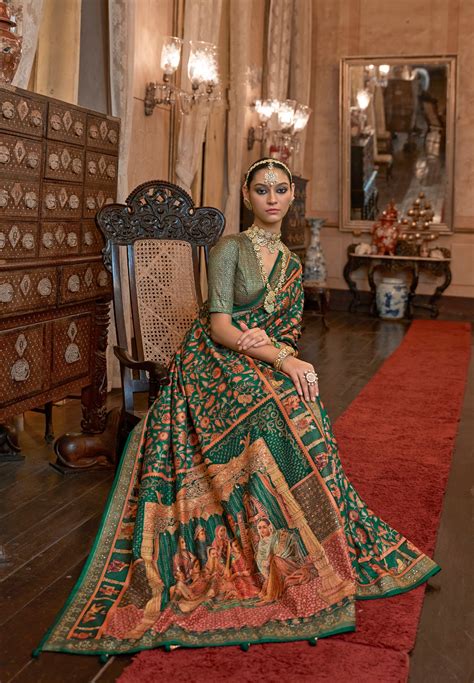 Green Patola Silk Saree with Traditional Motifs and Handmade Tassels ...