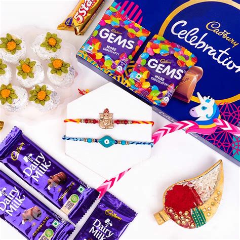Send Three Rakhi Set with Sweets N Cadbury Celebrations Online