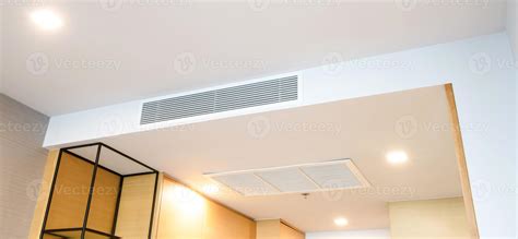 Ceiling mounted cassette type air conditioner and modern lamp light on ...