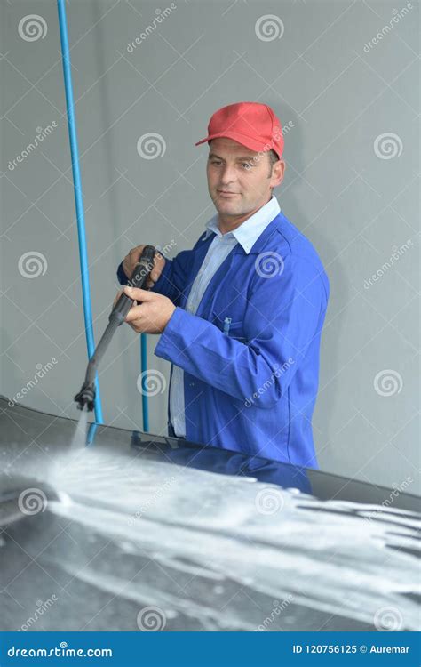 Carwash employee at work stock image. Image of service - 120756125