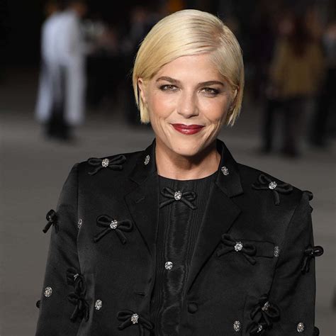 Download Selma Blair posing in a stylish outfit Wallpaper | Wallpapers.com