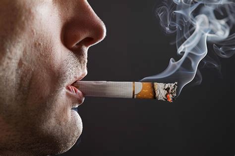 Dramatic depiction of smoke weaving around a smoker illustrating the ...