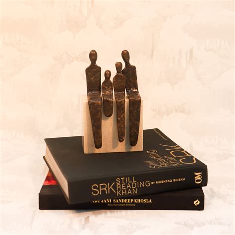 Family of four on a pedestal (Brass/Corian)