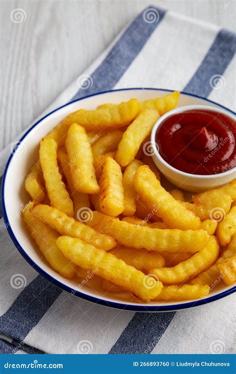 Homemade Unhealthy Crinkle French Fries with Ketchup on a Plate, Side ...